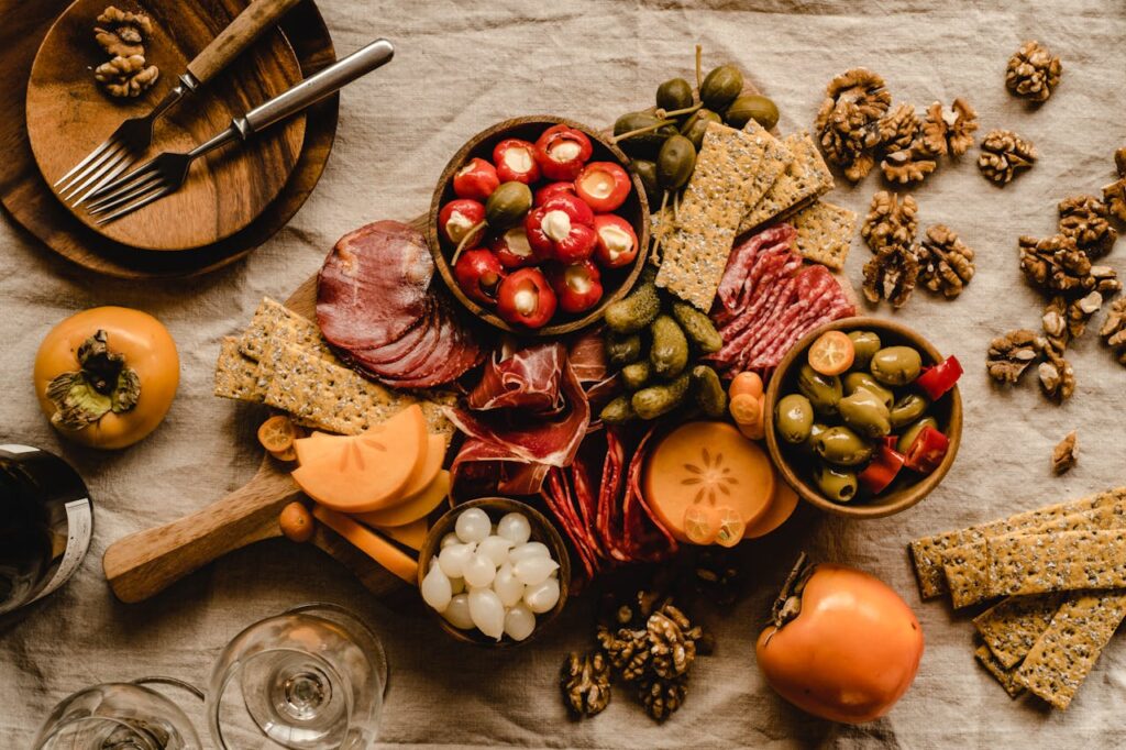 pexels photo 5975472 A beautifully arranged Mediterranean charcuterie board featuring meats, cheeses, olives, and nuts.